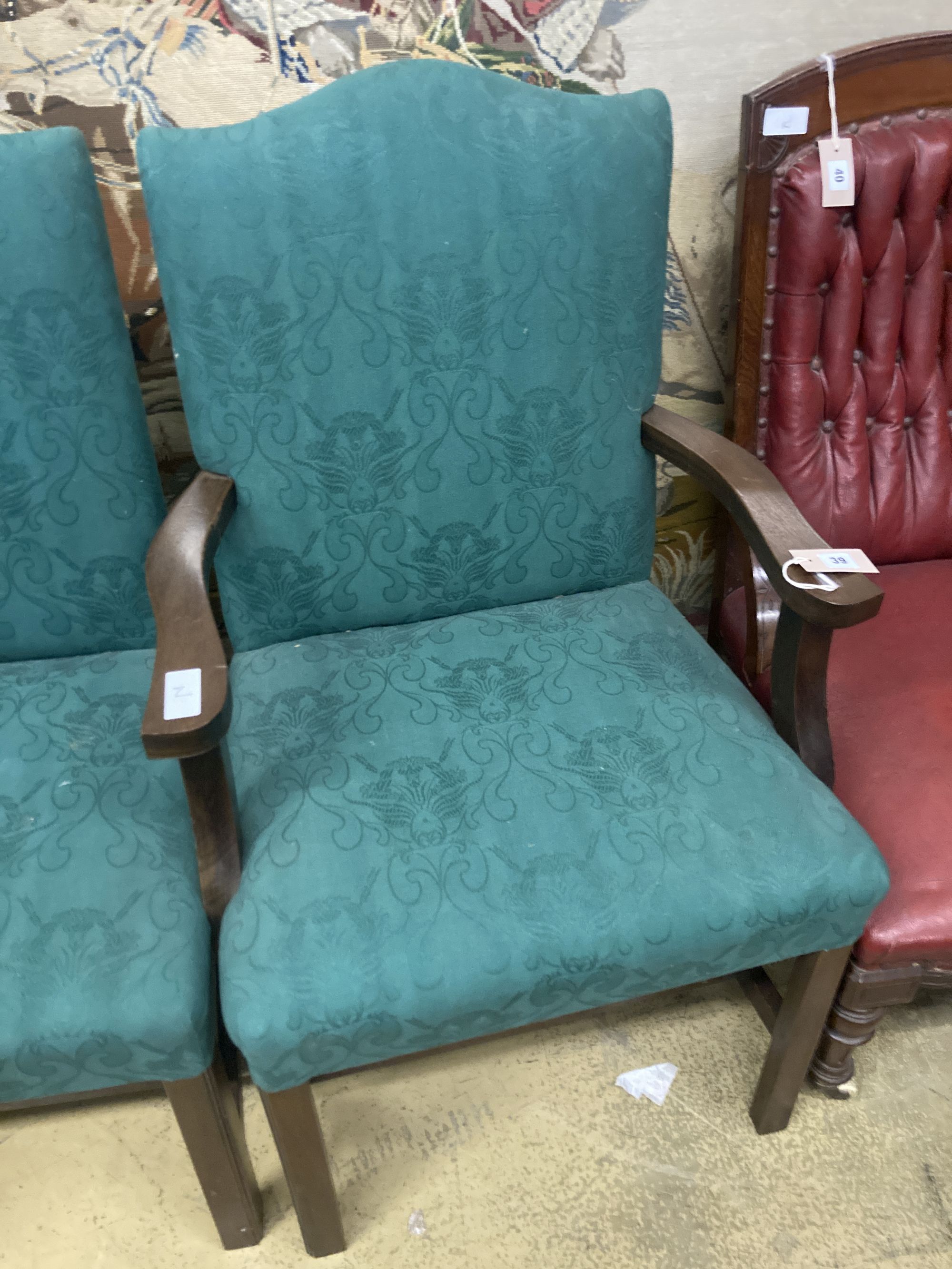 A pair of George III mahogany upholstered dining chairs (one with arms), width 62cm depth 52cm height 99cm